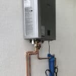 A tankless water heater mounted on a wall