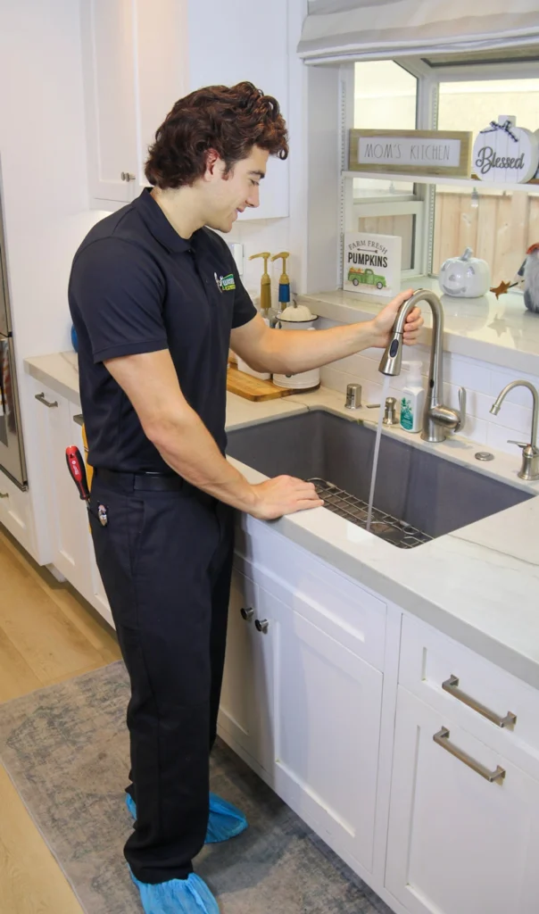 Repiping 4 Wiseway technician checking if local homeowners old kitchen sink if it needs a repiping