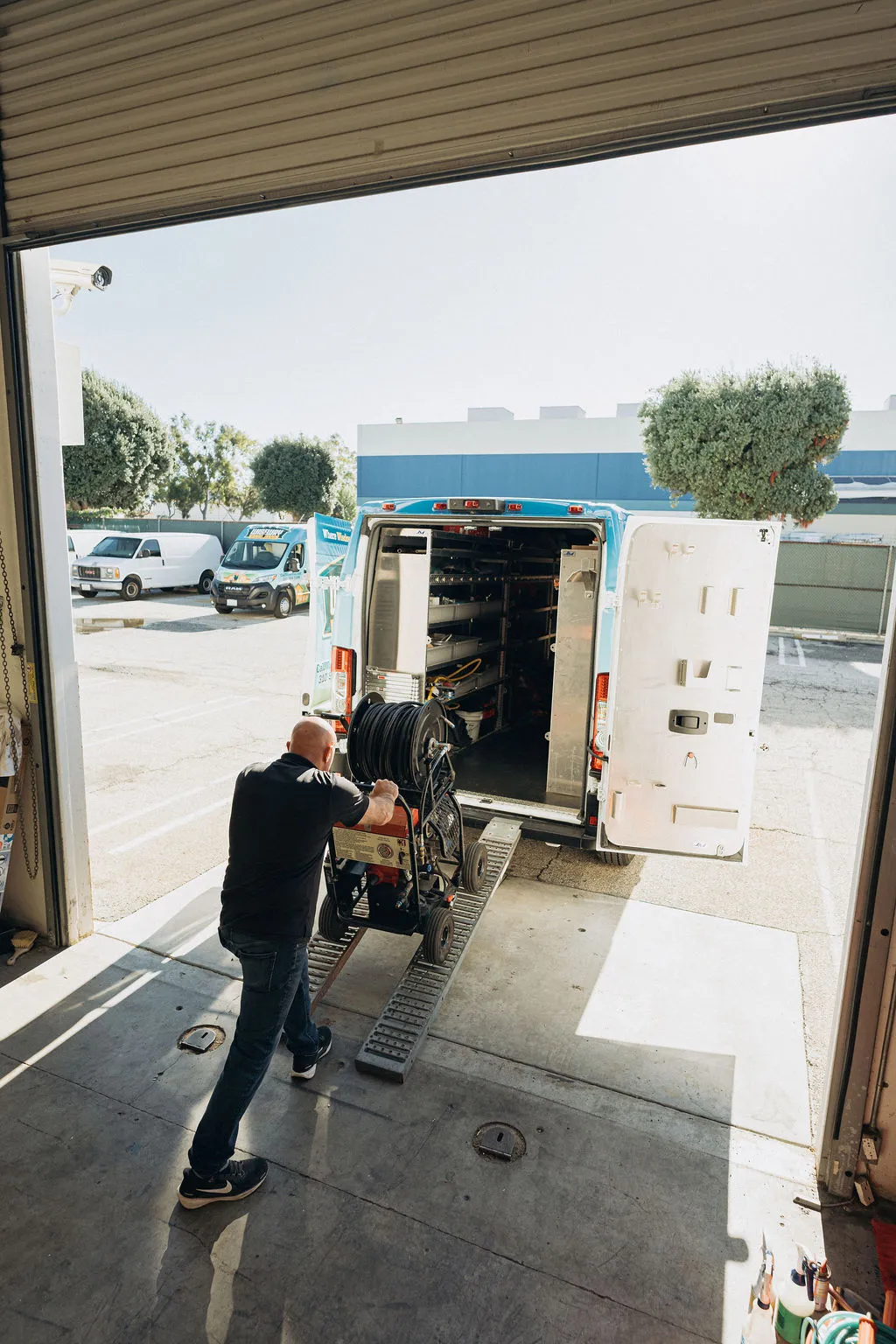 Wiseway technician loading plumbing equipment into truck