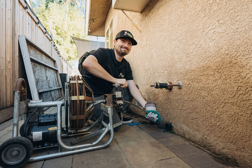 Wiseway technician using a snake at local customer home for leak detections