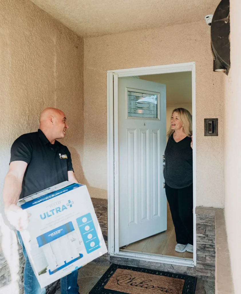 Anaheim 5 Wiseway plumbing technician doing a water filtration system installation in southern california home