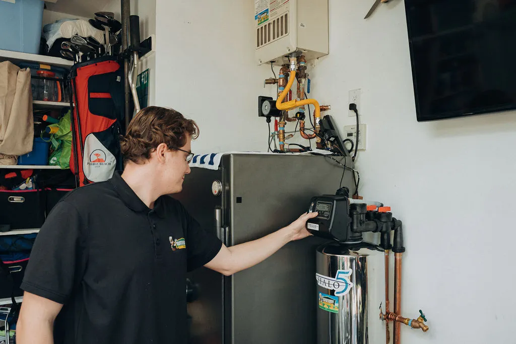Wiseway technician installing water softner at customer local home